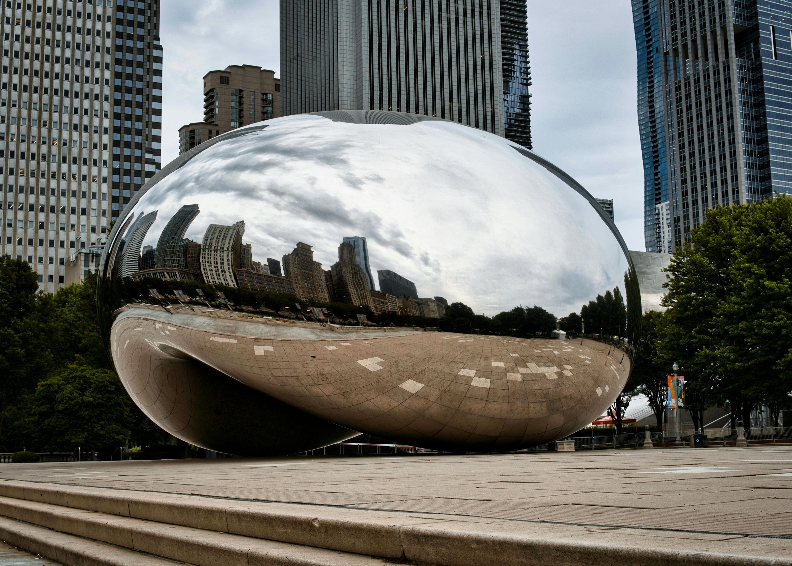 Cloud Gate Bean sculpture in Chicago Millennium Park reflecting the skyline